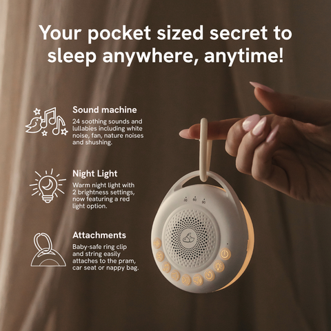 A hand holds a small beige portable baby sleep machine with a wooden clip against a warm brown background. Text on the left highlights features: sound machine, night light, and attachments.